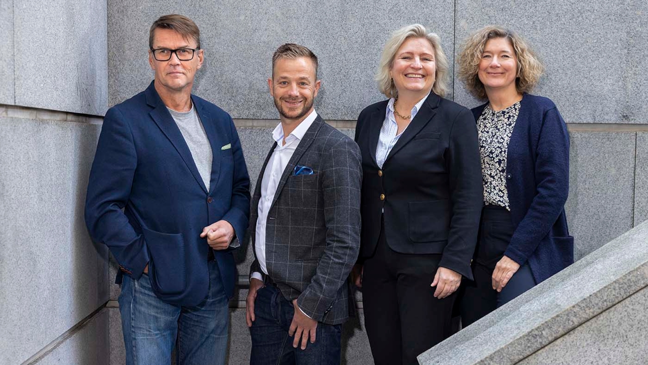 Gruppebilde av de fire ansatte i administrasjonen